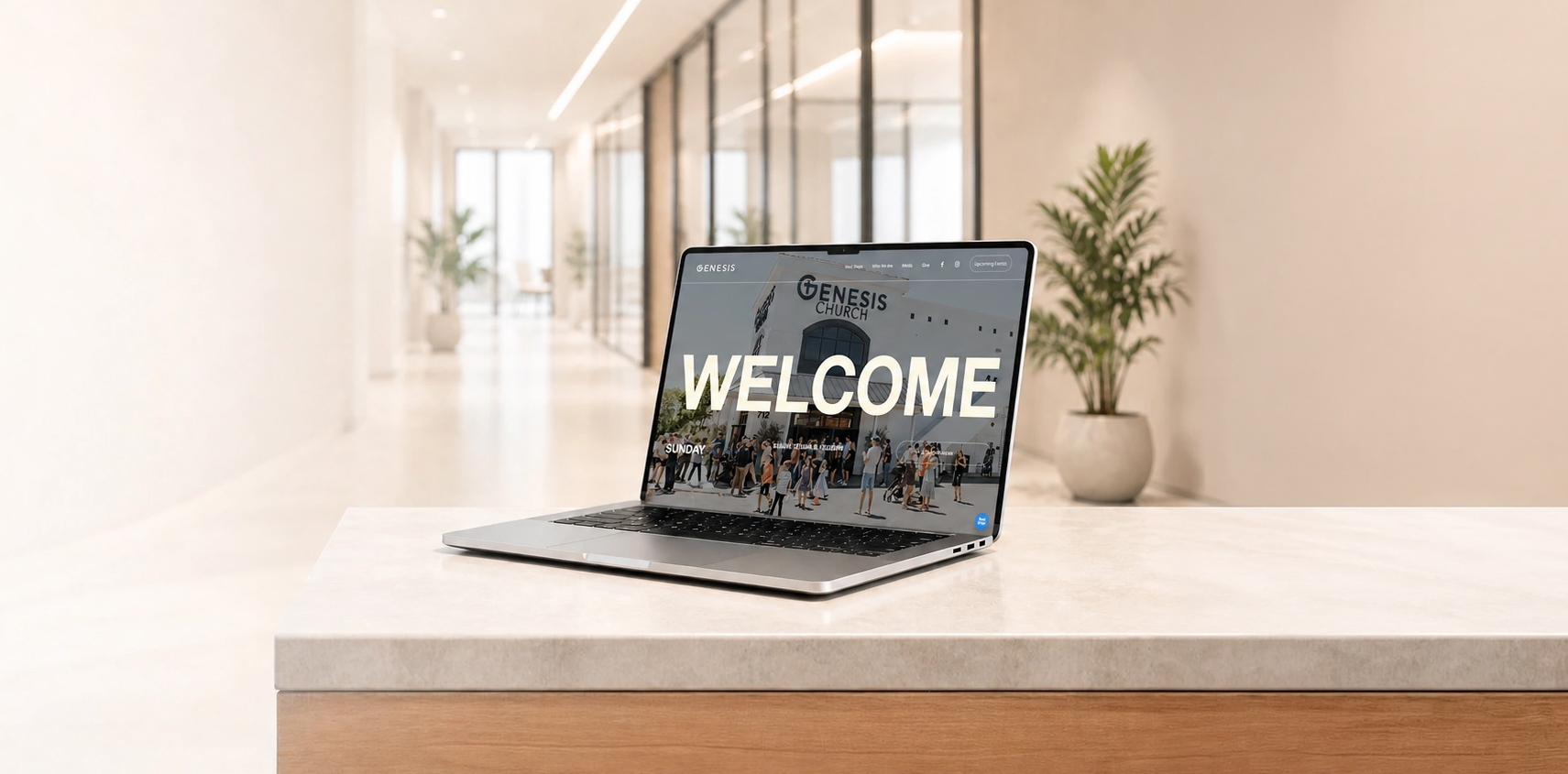 Genesis Church custom church website design by Bozh Studio, shown on a laptop in a bright modern lobby, featuring a bold "WELCOME" headline over a photo of the congregation gathered outside the building.